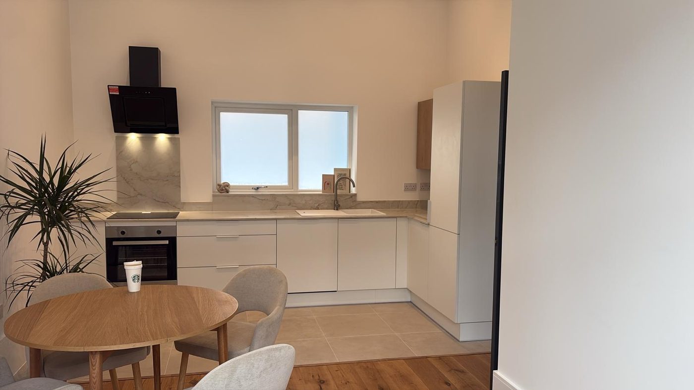 Finished apartment kitchen and dining area