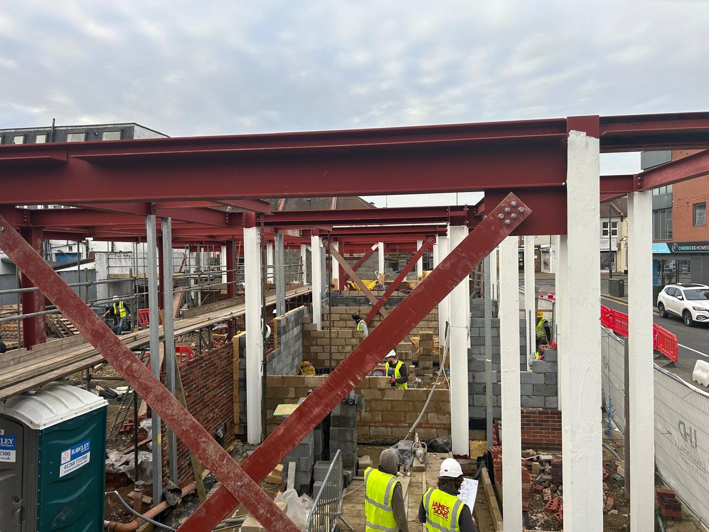 James and Sons team members working on a steel framed construction site