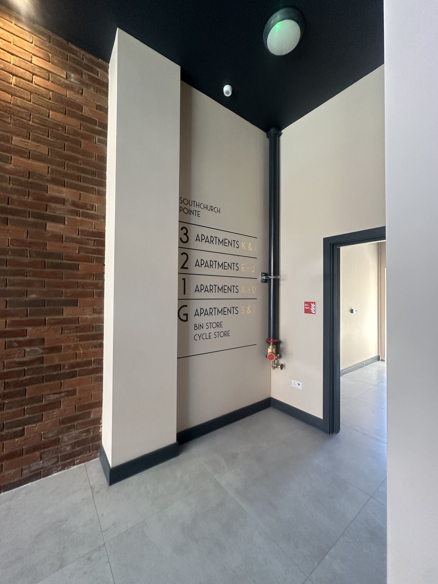 Apartment building entrance lobby with numbered doors