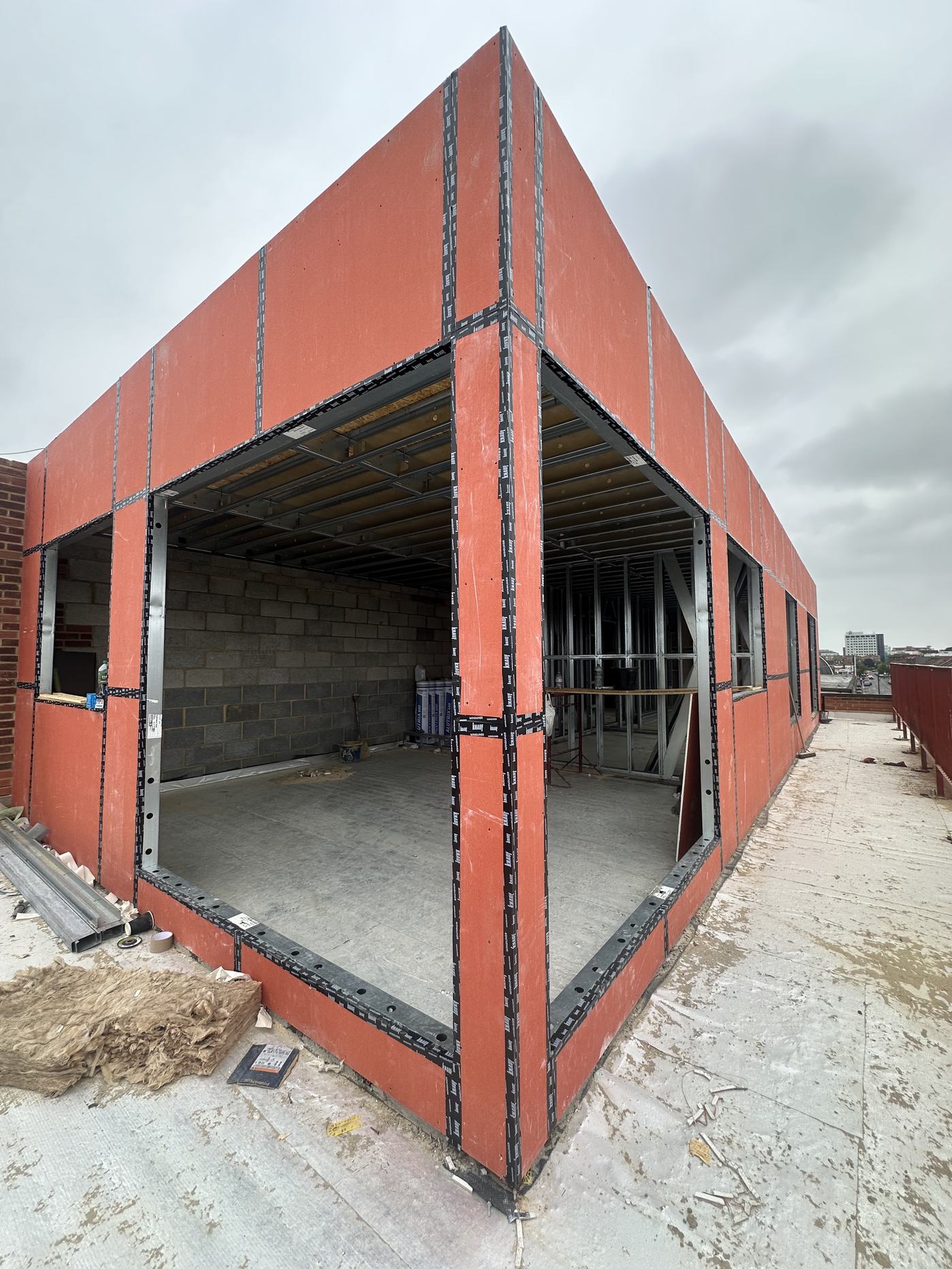 Close up of a red steel frame corner junction